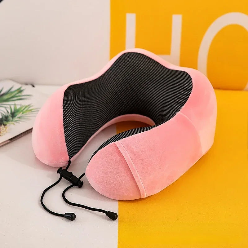 memory foam travel pillow resting on travel bag
